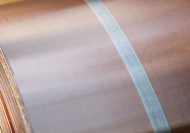 glossary-clad-metal-specialties A close up of a roll of copper foil.